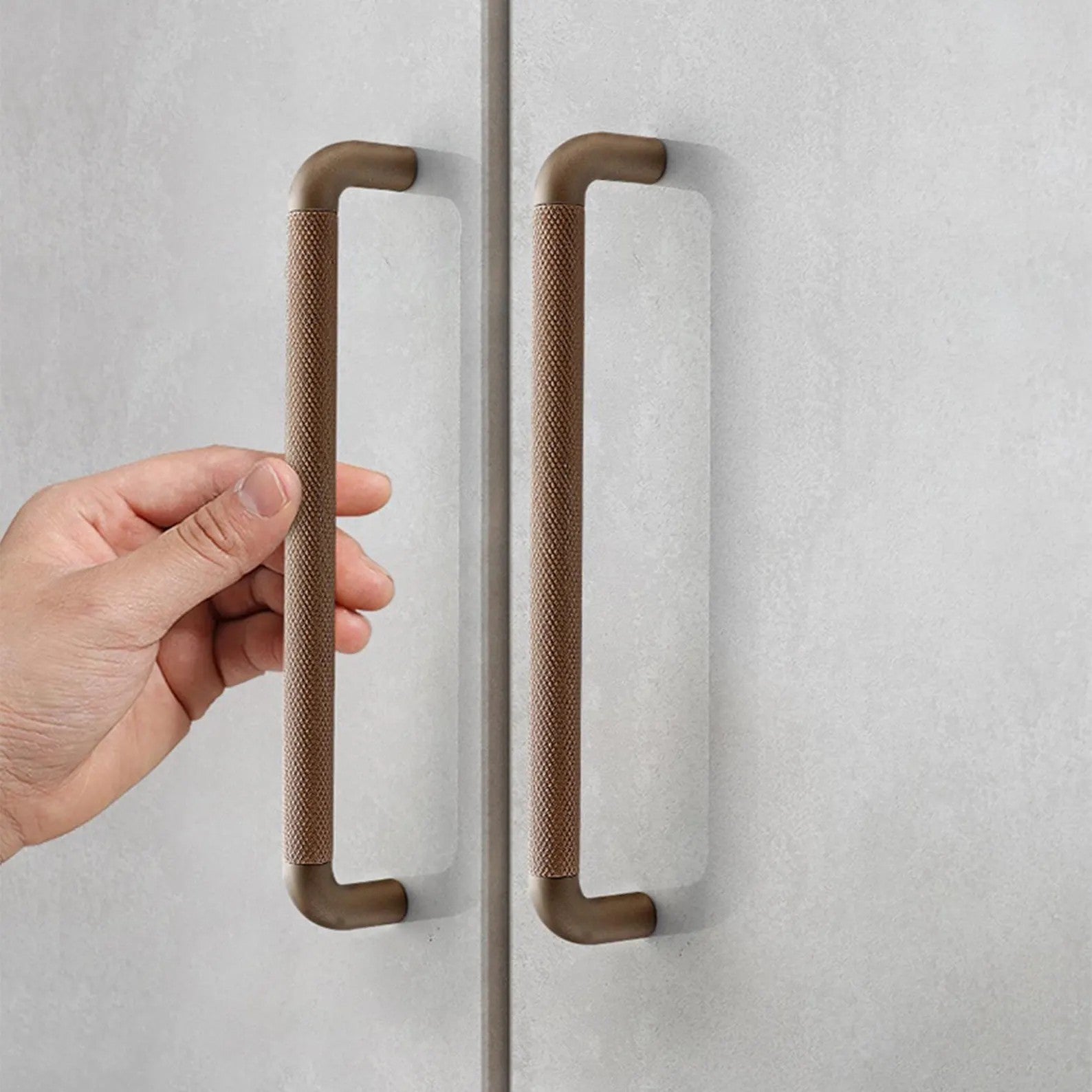 Brass essence textured zinc alloy bar and knob handle set with modern industrial design, featuring a sleek, durable finish.