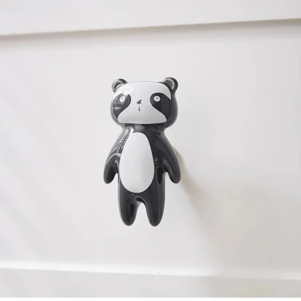 Brass Essence ceramic animal cabinet pull featuring a detailed animal design, perfect for adding charm to furniture.