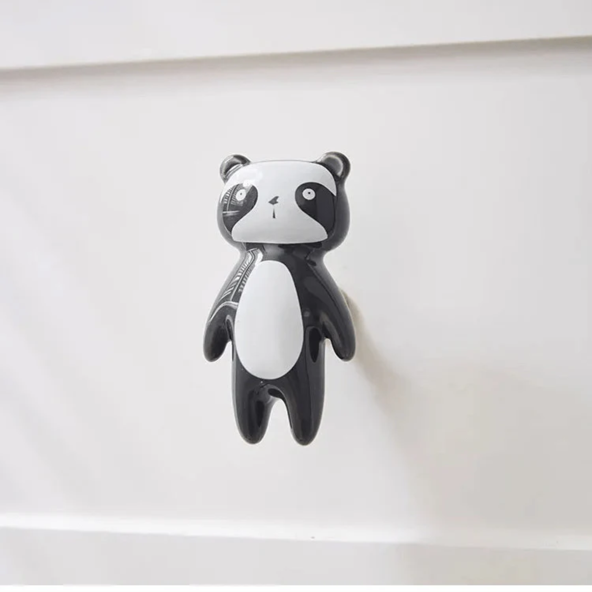 Brass Essence ceramic animal cabinet pull featuring a detailed animal design, perfect for adding charm to furniture.