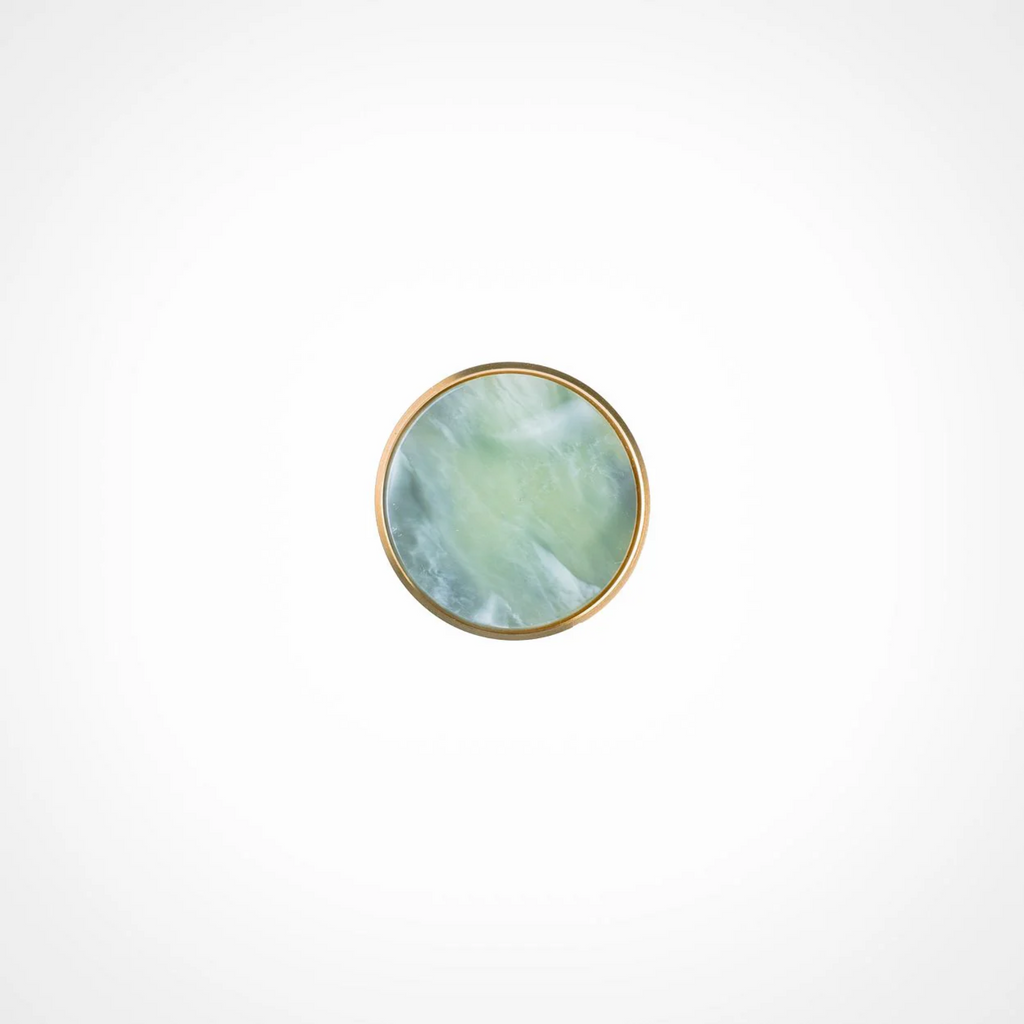 Acrylic and brass disc cabinet knob by Brass Essence, featuring a sleek round design with a brass finish and clear acrylic center.