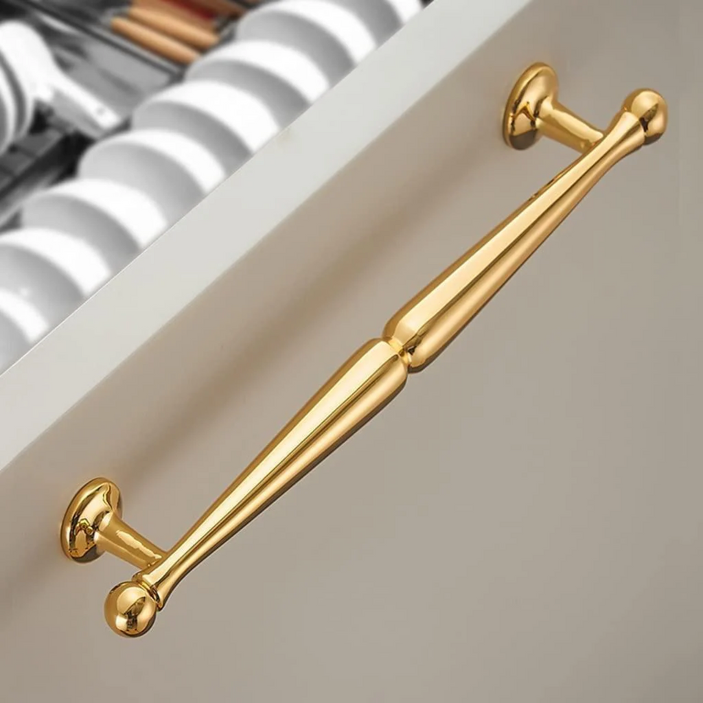 Brass essence Nishilia tapered brass cabinet handle from the B-0069 collection, featuring a sleek, tapered design for cabinets.