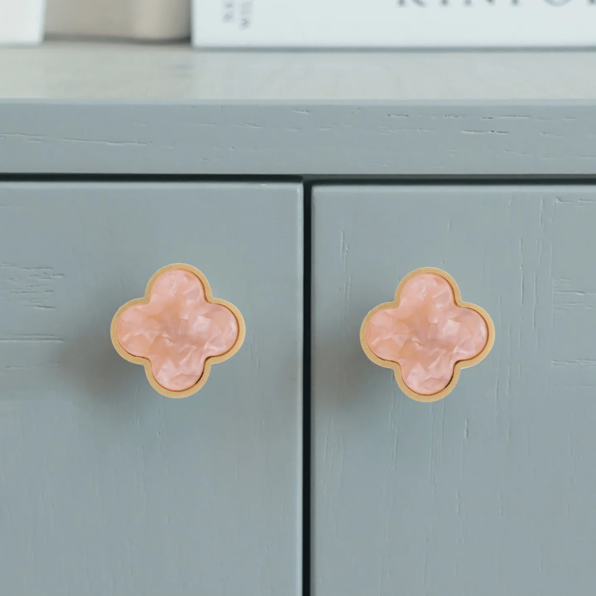 Brass Essence Clover Brass Cabinet Knob from the A-0006 collection, showing a polished brass cabinet handle with a clover shape design.