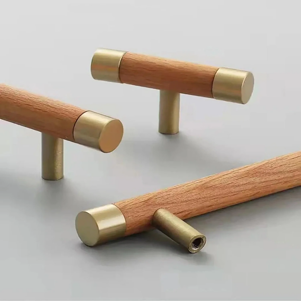 Natural wood and brass T-bar handle from Brass Essence collection, showcasing sleek, modern hardware with wood and brass finish.