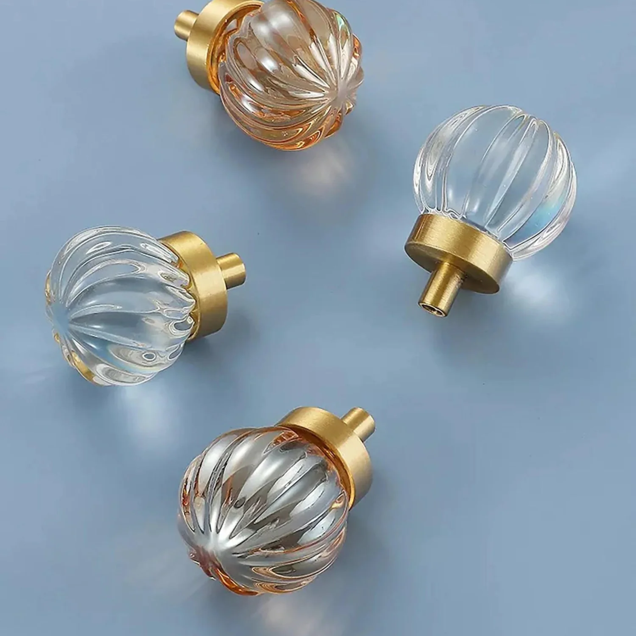 Brass Essence crystal drawer pull with fluted and smooth design, featuring clear glass with a polished metal finish.