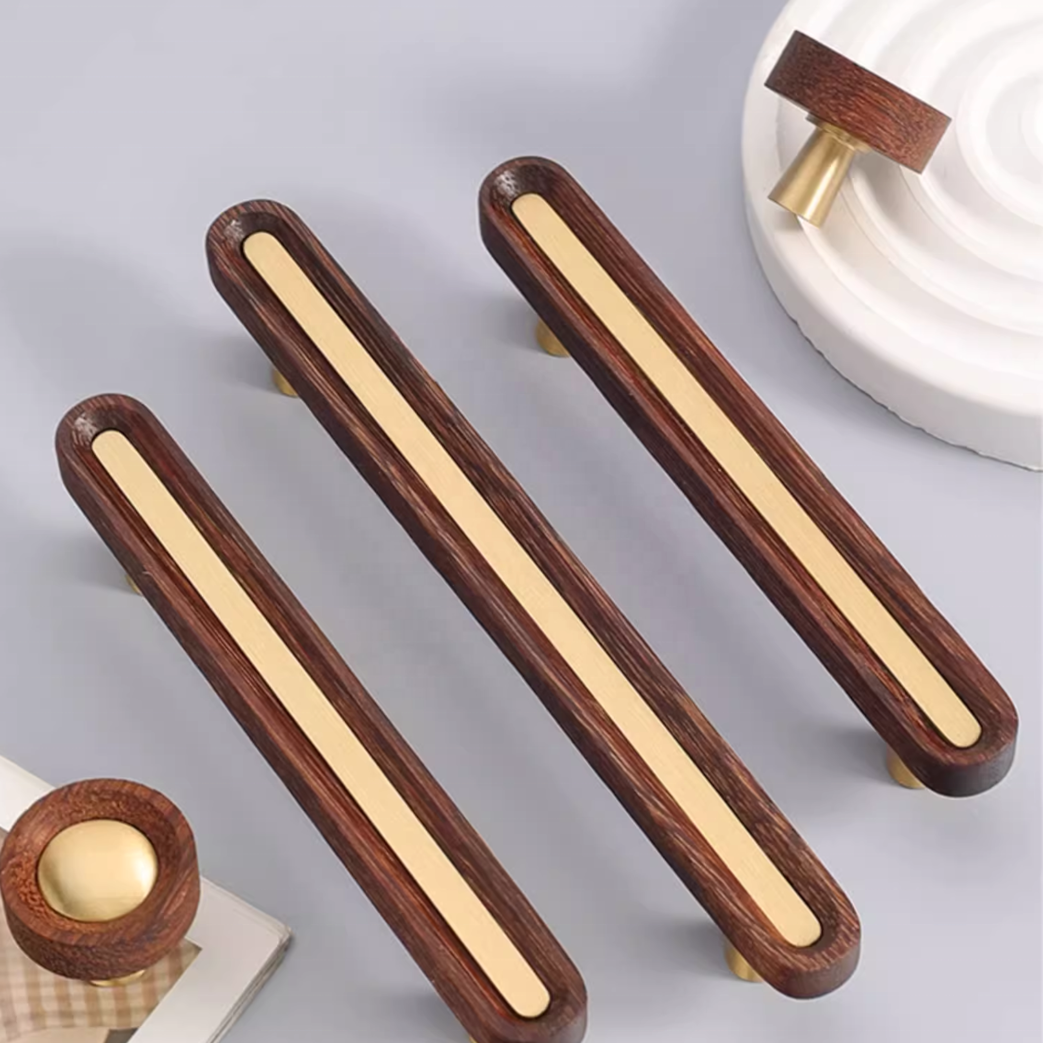 Brushed brass and wenge wood handle by Brass Essence, showcasing sleek, modern design with a polished brass finish and dark wood accents.