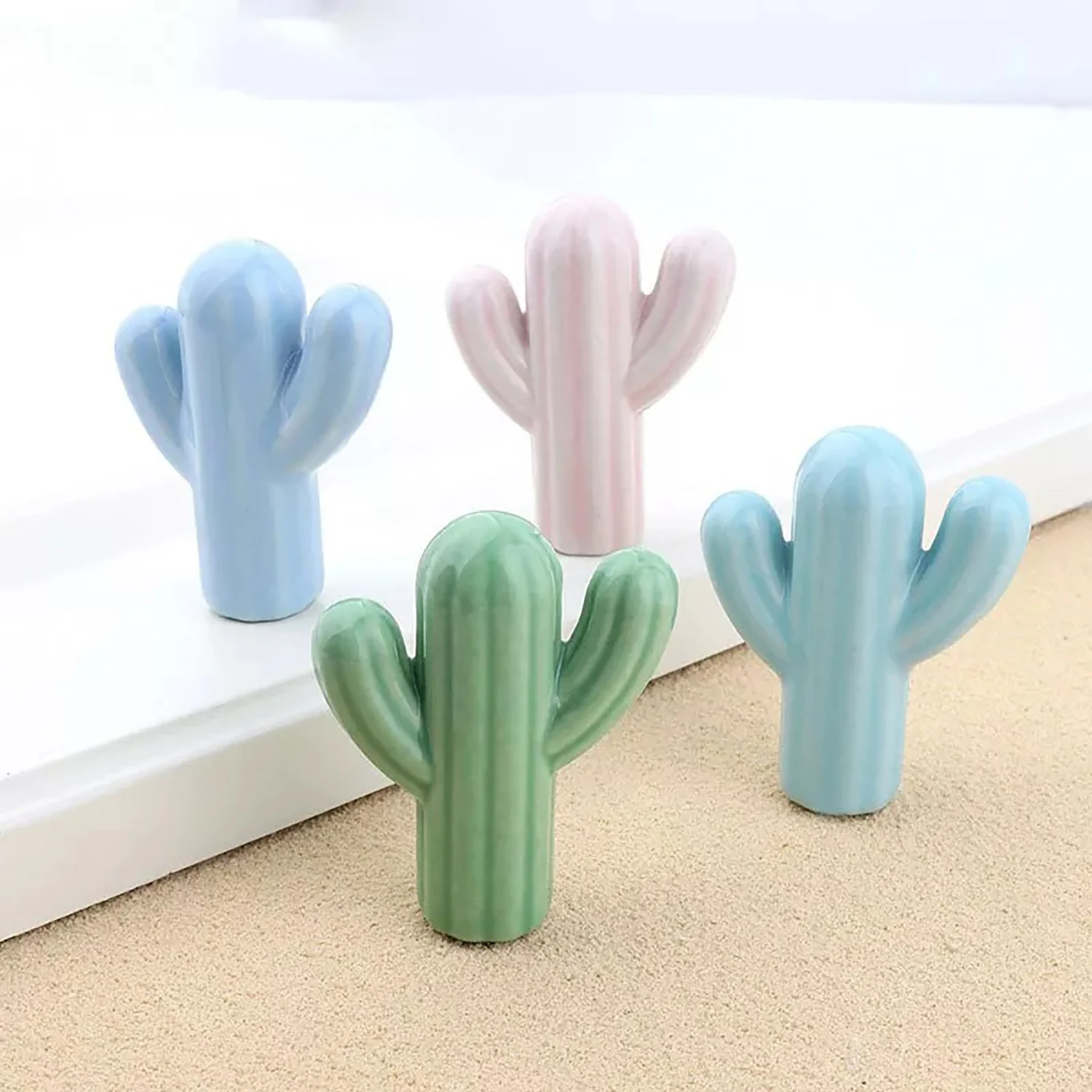Brass Essence ceramic cactus cabinet knob with green and beige cactus design, ideal for kitchen or furniture drawers.