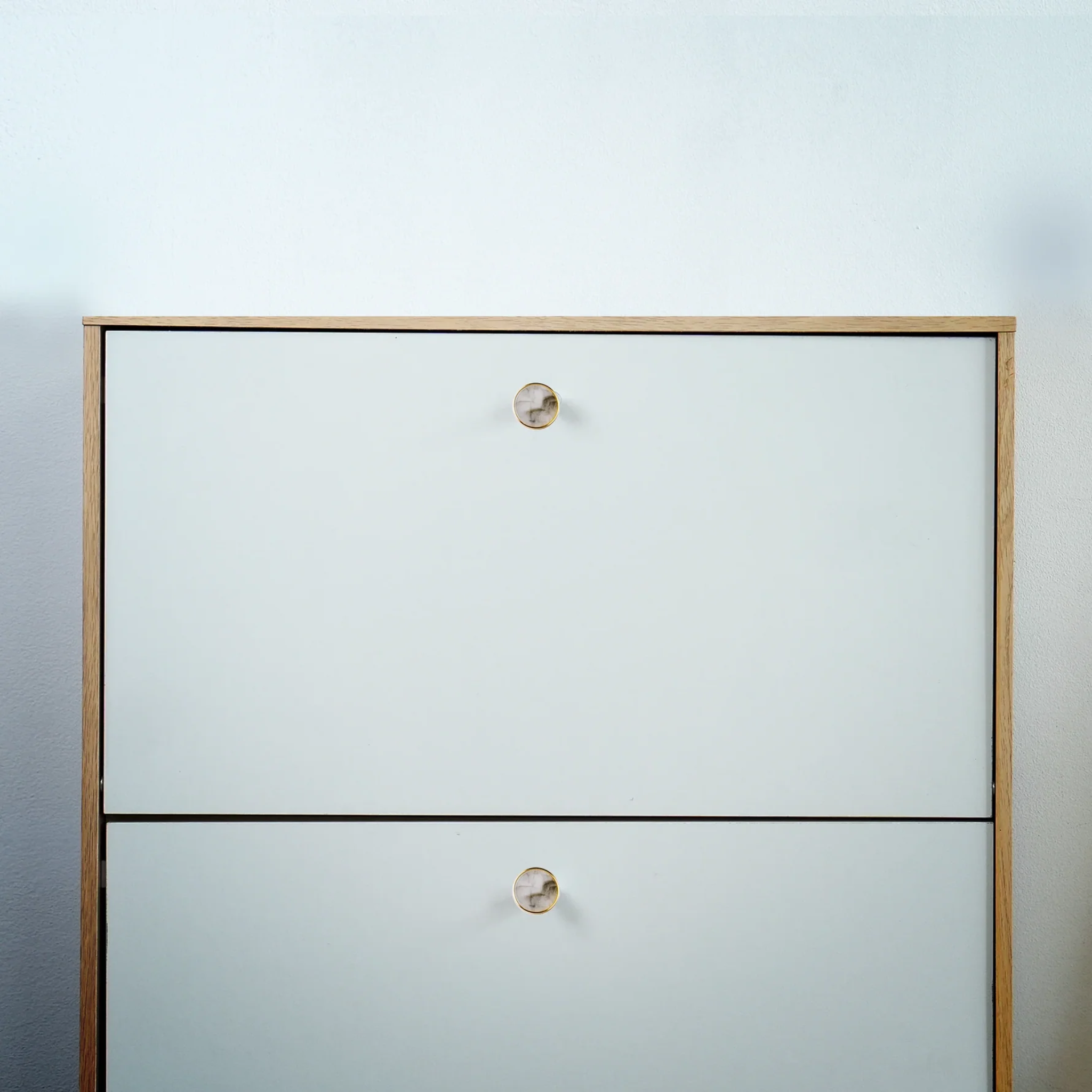 Acrylic and brass disc cabinet knob by Brass Essence, featuring a round design with a sleek brass finish and clear acrylic top.