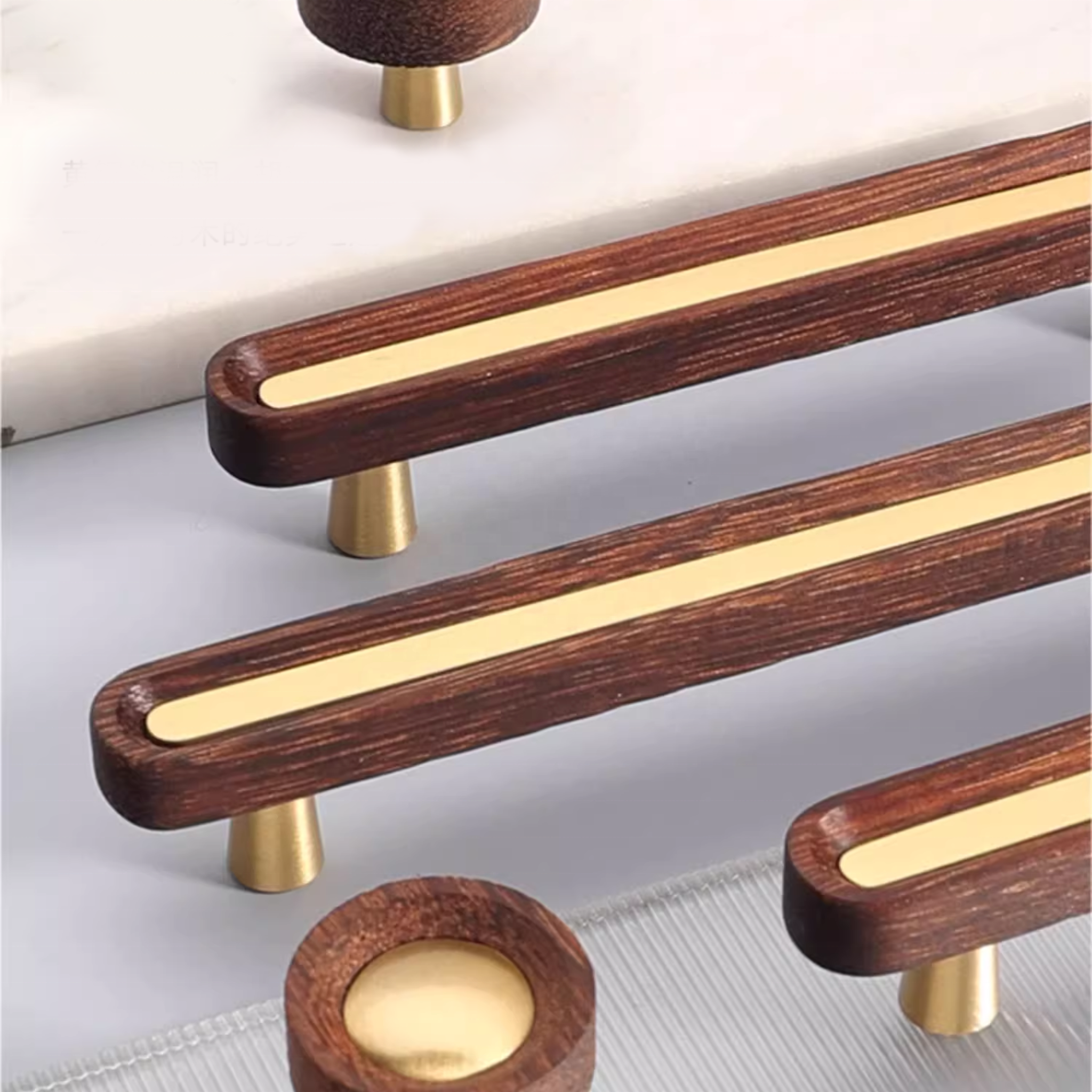 Brass Essence brushed brass and Wenge wood handles showing sleek, modern design with smooth brass finish and dark wooden accents.