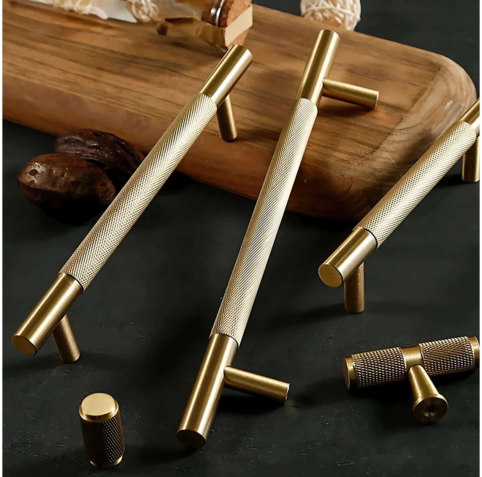 Brass essence Yashvite knurled brass cabinet handle from collection B-0060, showing close-up of textured, polished handle on a cabinet.