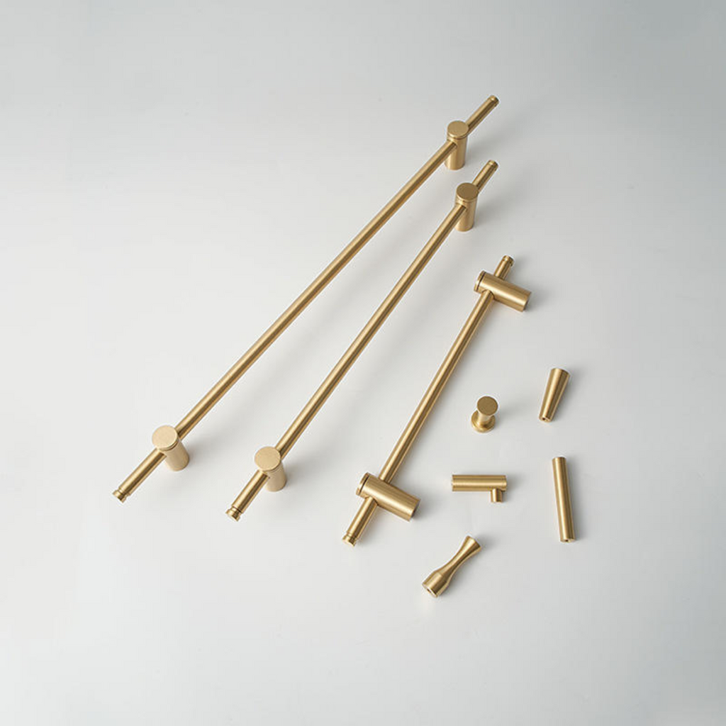 Adjustable solid brass bar handle from Brass Essence collection, showing a sleek, polished brass finish and sturdy construction.