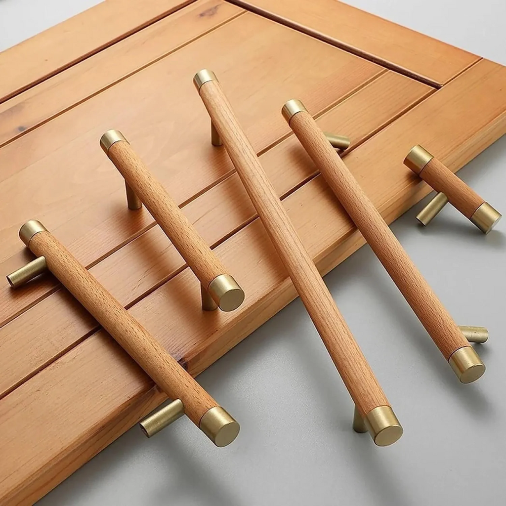 Natural wood and brass T-bar handle from Brass Essence collection, showcasing sleek design and polished finish.
