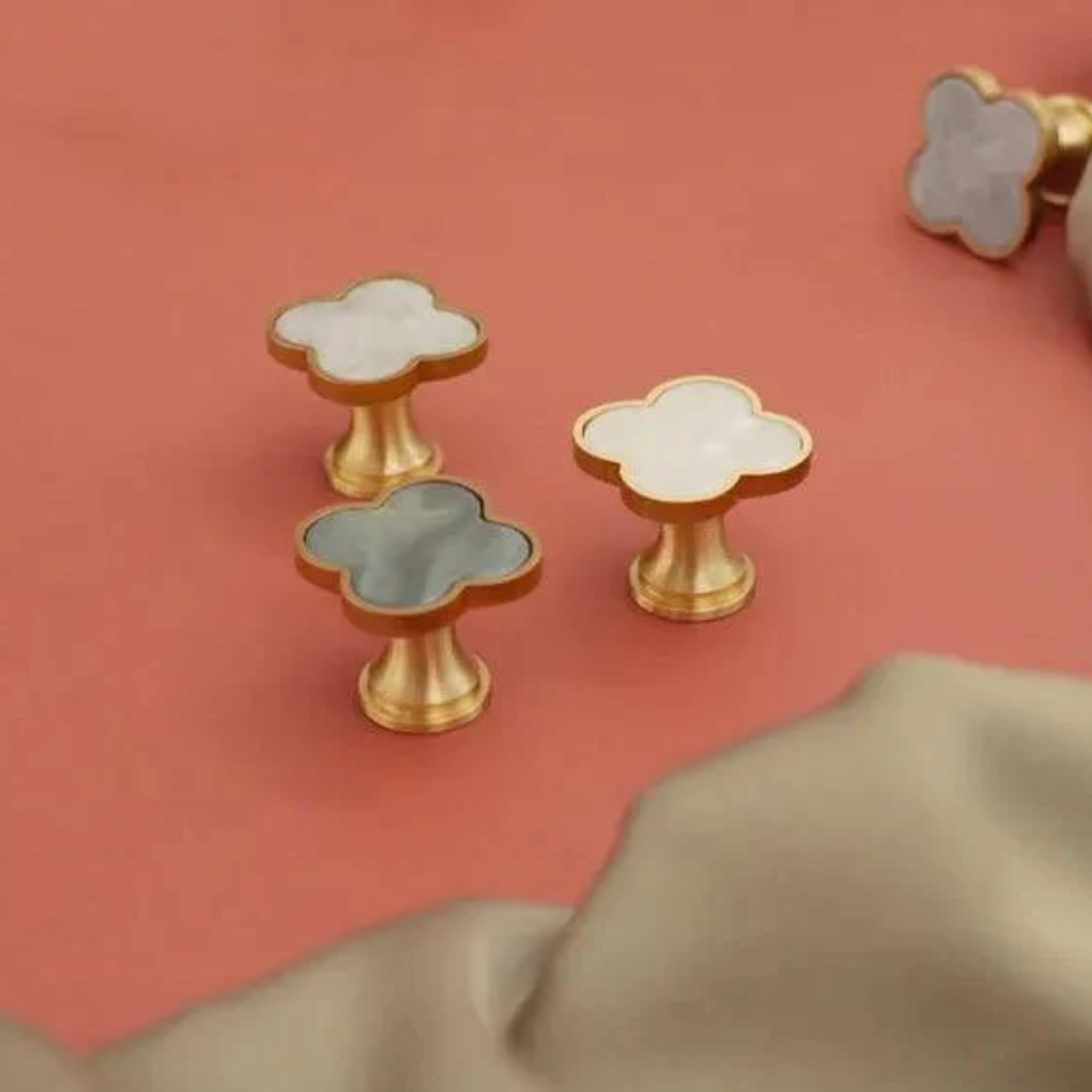 Brass essence Clover Brass Cabinet Knob from collection A-0006, showing a polished brass cabinet knob with a rounded design.