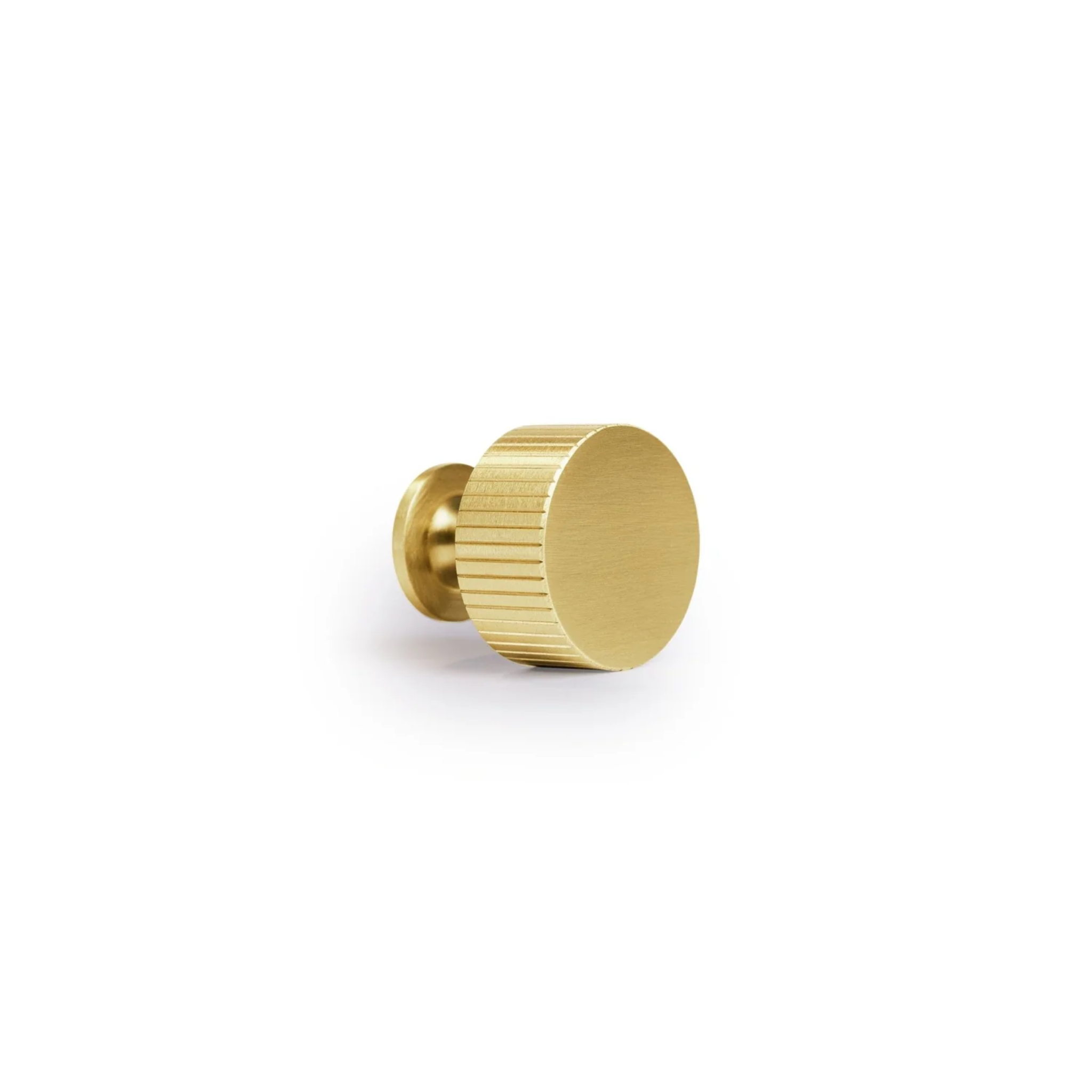 Brass Essence linear knurled brass cabinet knob with textured surface, modern hardware for furniture or cabinetry.