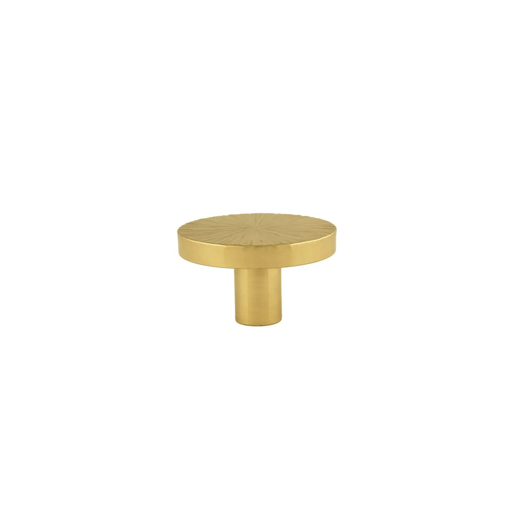 Hammered Sunburst Brass Cabinet Knob by Brass Essence, showcasing a textured, shiny brass handle with sunburst design.