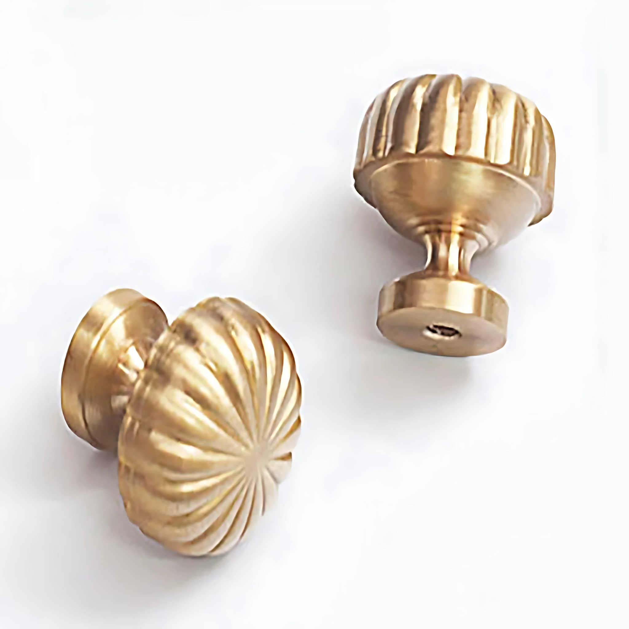 Brass Essence fluted pumpkin solid brass cabinet knob in gold finish, showing detailed textured surface and rounded shape.