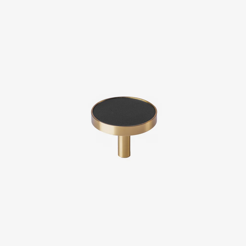 Brass Essence brushed brass and leather round handle with sleek design, showcasing a stylish combination of brass and leather materials.