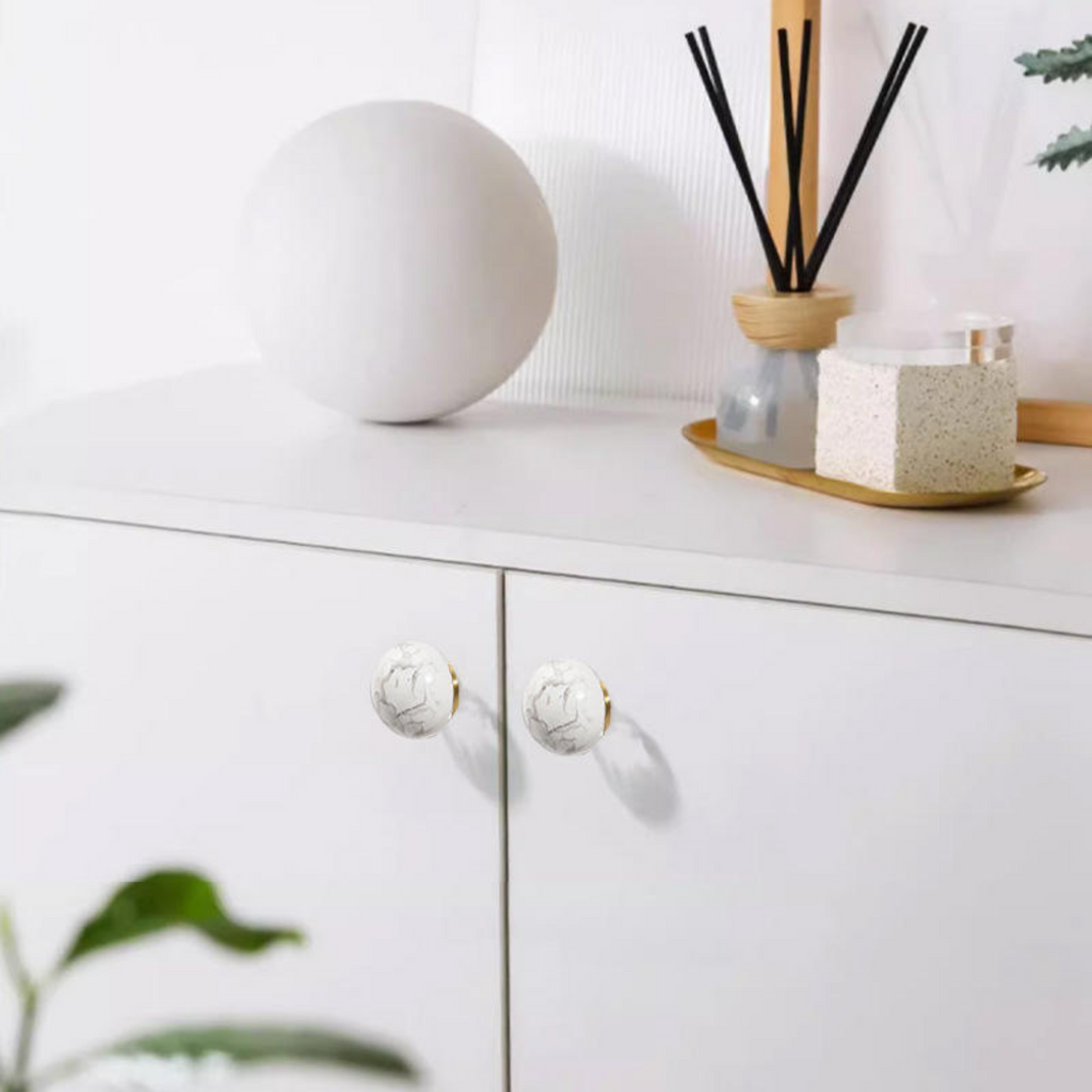 Natural crystal ball and brass cabinet knob by Brass Essence, showcasing a clear glass sphere and ornate brass handle.