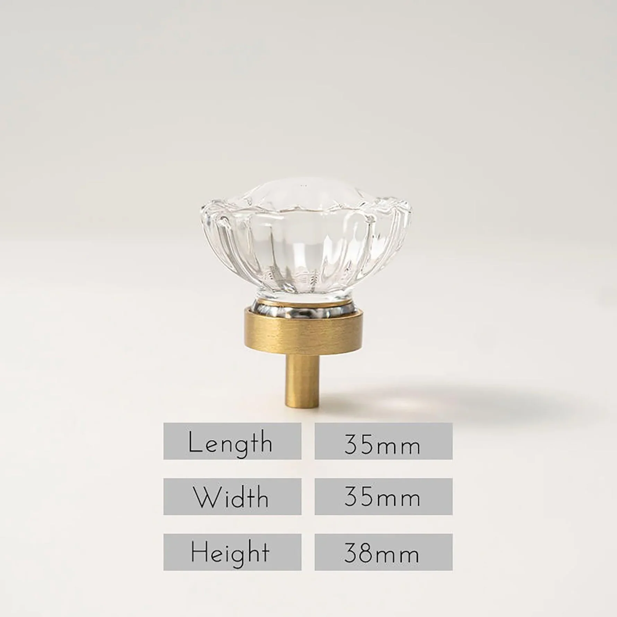 Faceted crystal and brass cabinet knob by Brass Essence, featuring a sparkling crystal design and polished brass finish.