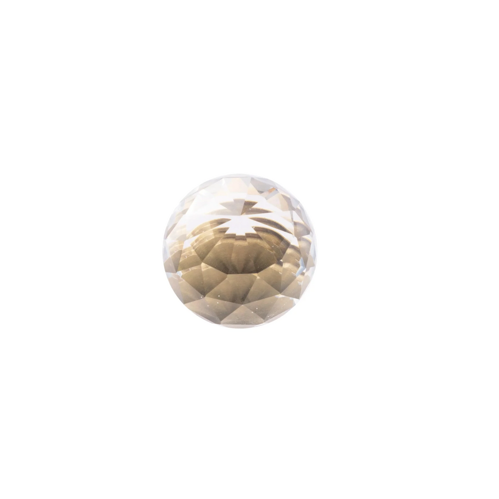 Faceted crystal and brass cabinet knob by Brass Essence, showcasing a sparkling crystal with polished brass base and decorative design.