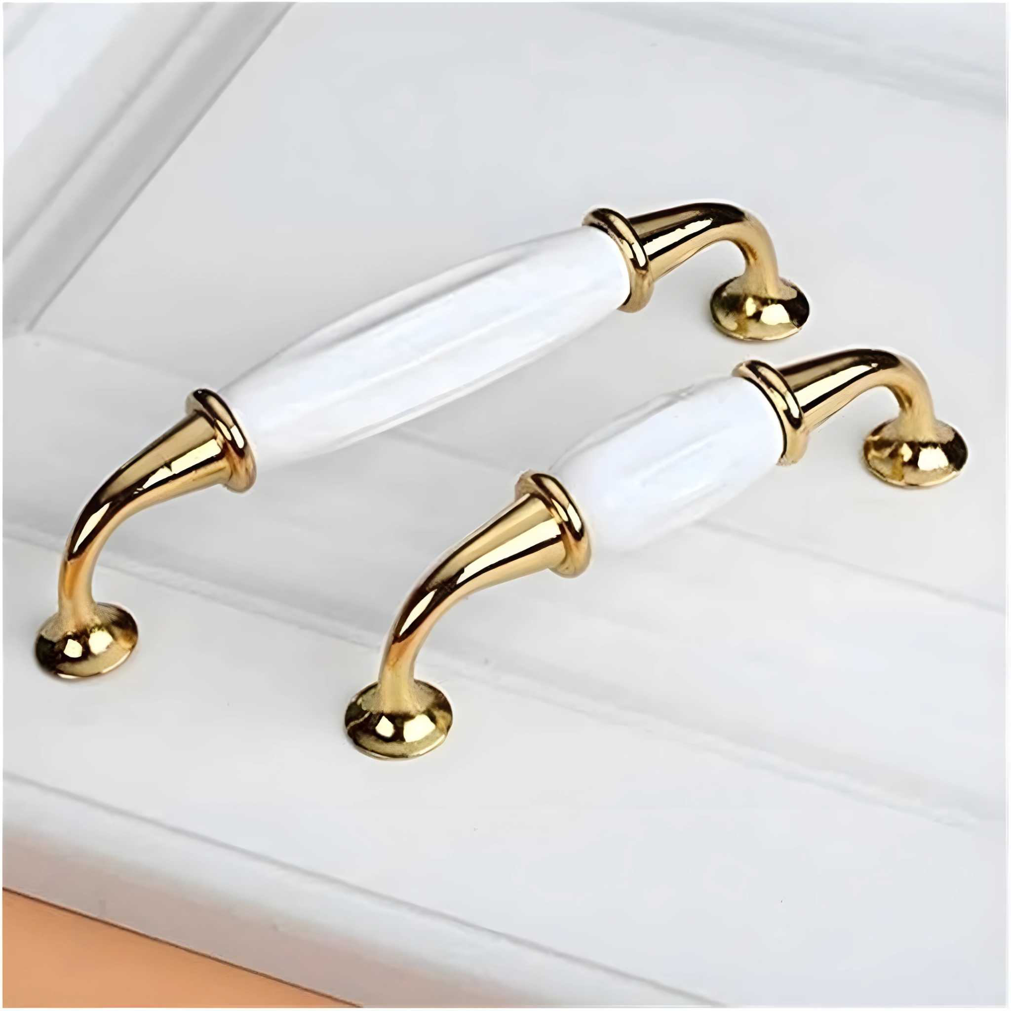 Polished ceramic and zinc cabinet pull from Brass Essence, CR 3030, featuring a sleek, shiny finish and modern design.