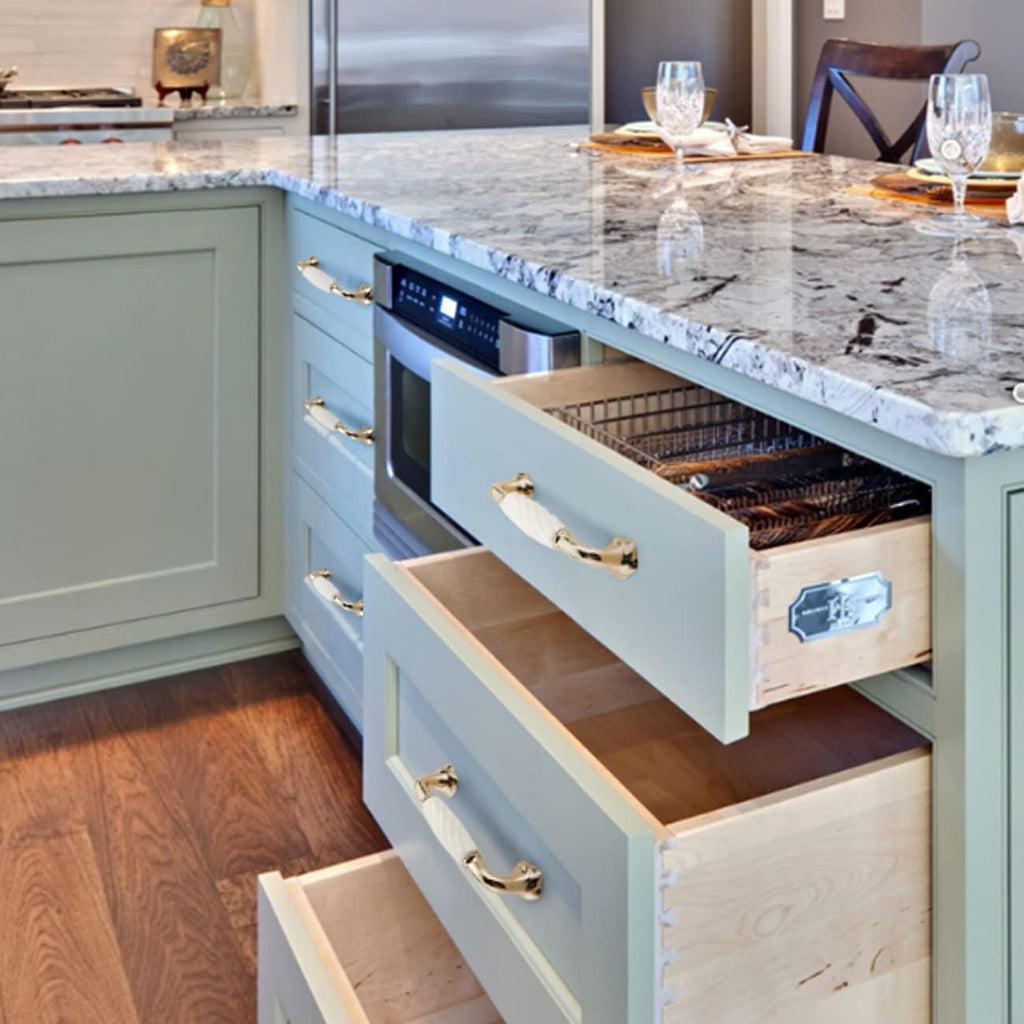 Brass Essence ridged ceramic and zinc cabinet pull with sleek design and textured surface for modern kitchen cabinetry.
