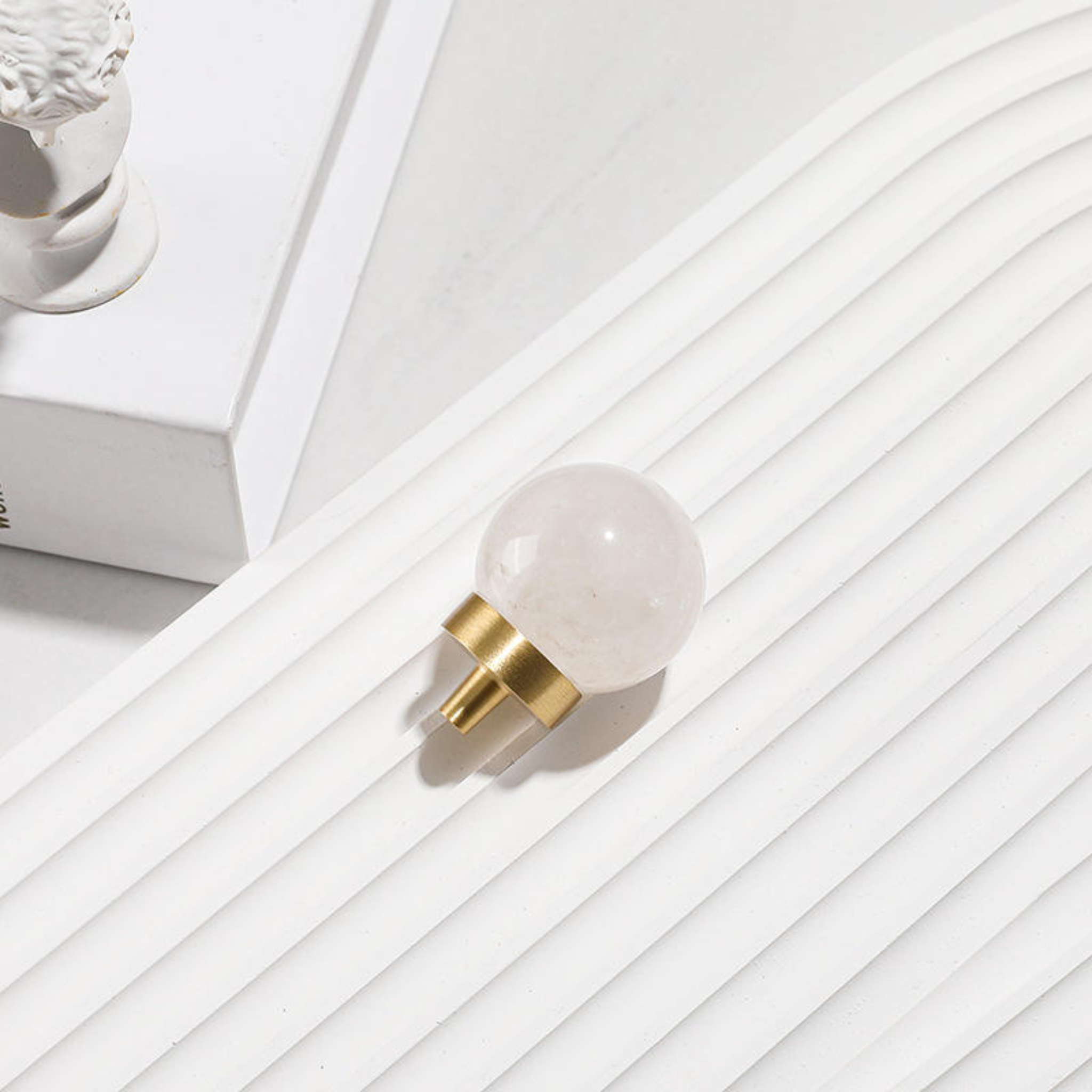 Brass Essence natural crystal ball and brass cabinet knob, decorative antique-style hardware featuring a clear glass ball and brass finish.