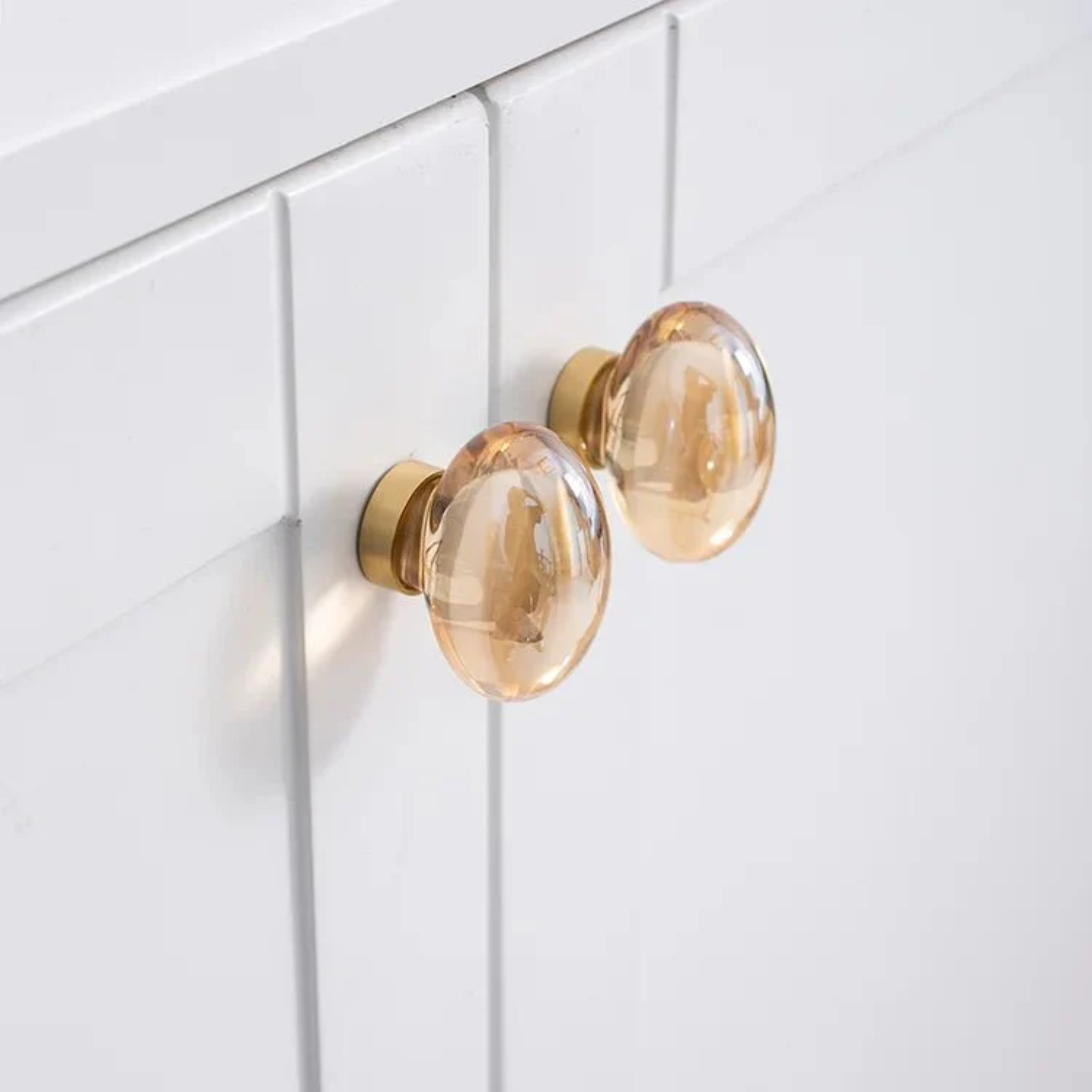 Elegant classic crystal with brushed brass handle, showcasing a refined design from Brass Essence.