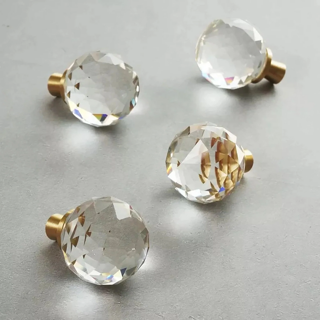 Faceted crystal and brass cabinet knob by Brass Essence, showcasing a shiny crystal top with a brass base for elegant furniture hardware.