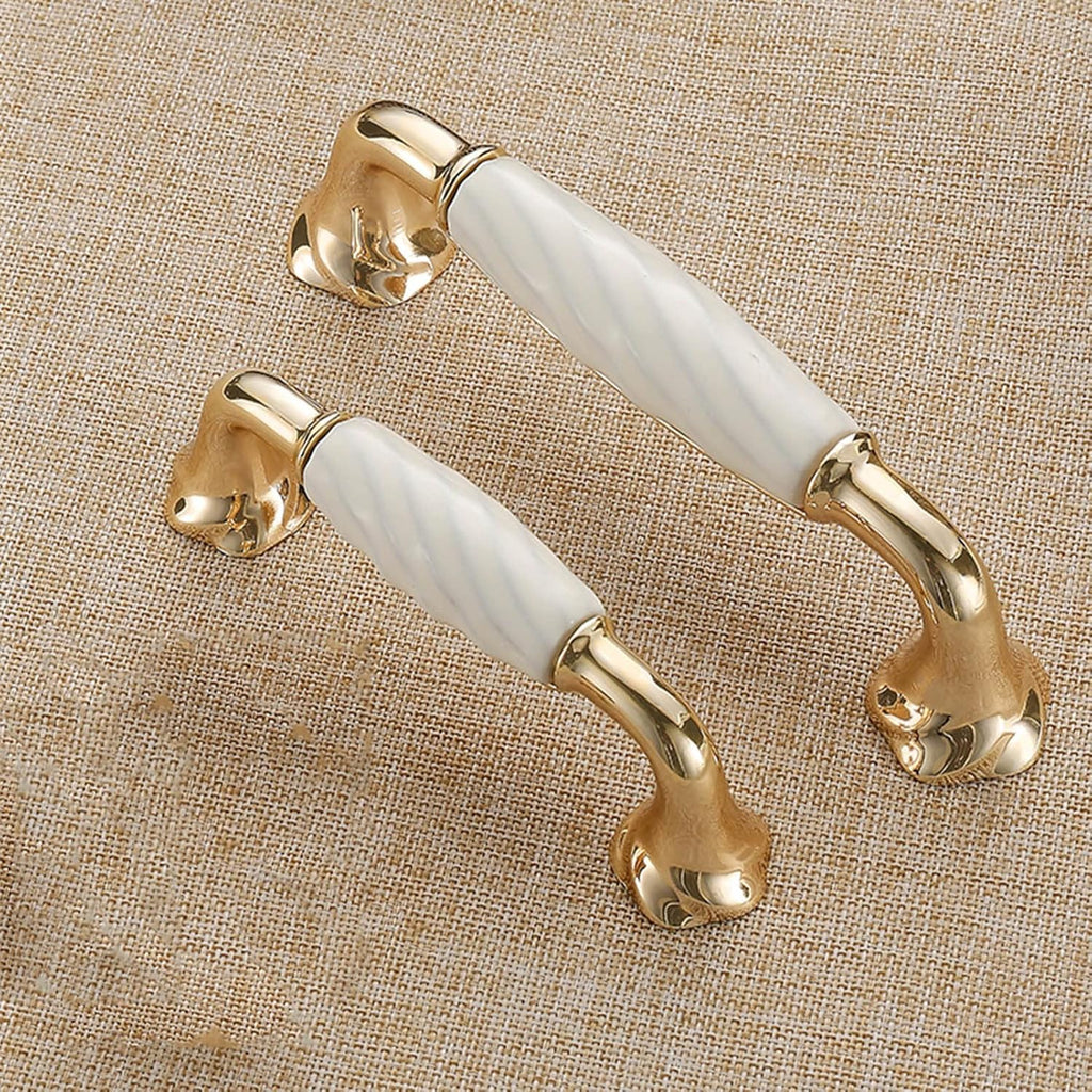 Brass Essence ridged ceramic and zinc cabinet pull with sleek metallic finish, featuring textured ridges for grip and style.