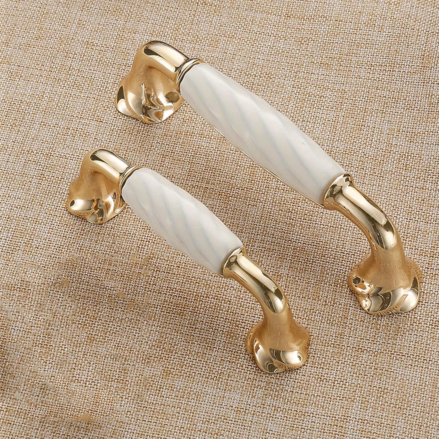 Brass Essence ridged ceramic and zinc cabinet pull with sleek metallic finish, featuring textured ridges for grip and style.