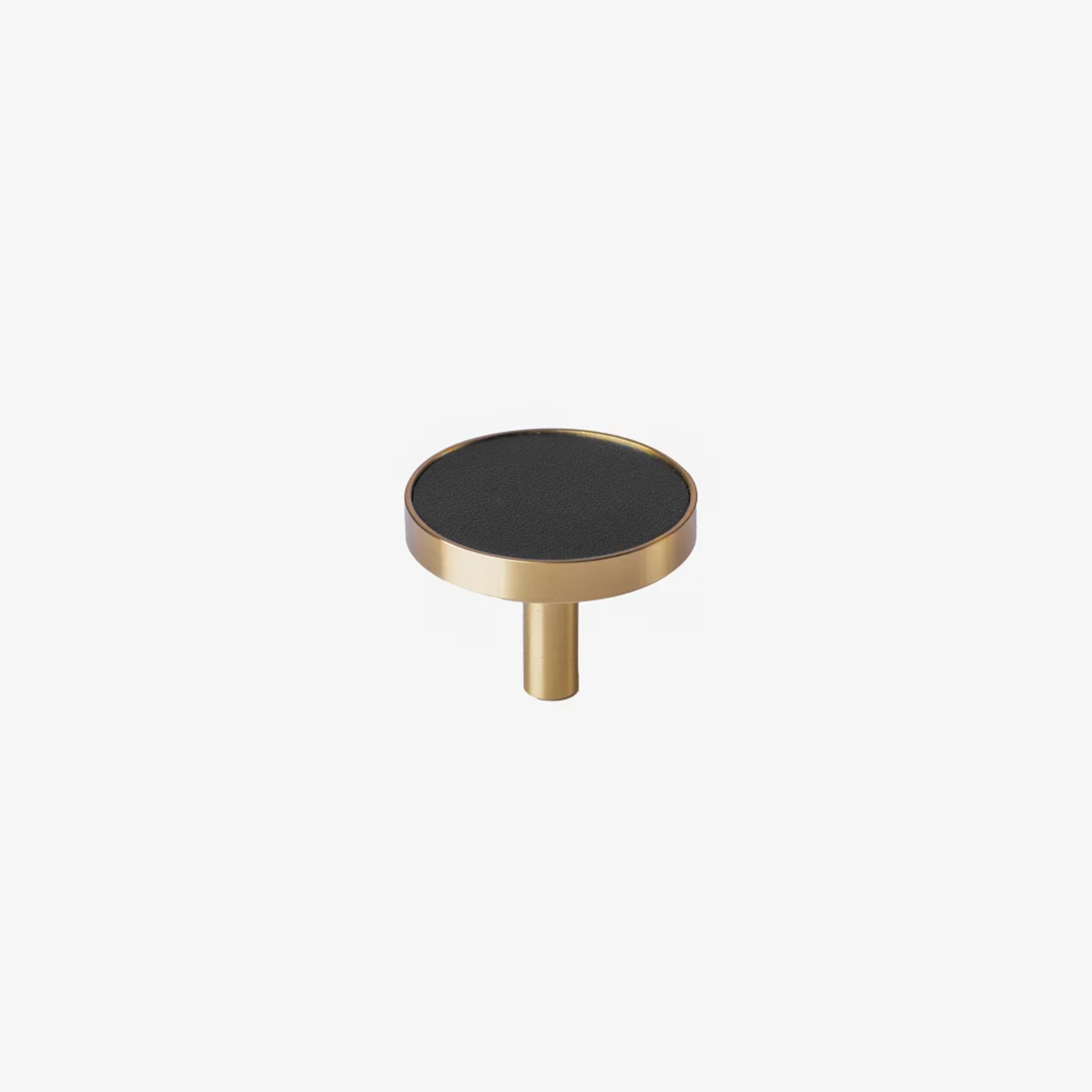 Brass essence brushed brass and leather round handle with a sleek, polished design suitable for furniture or doors.