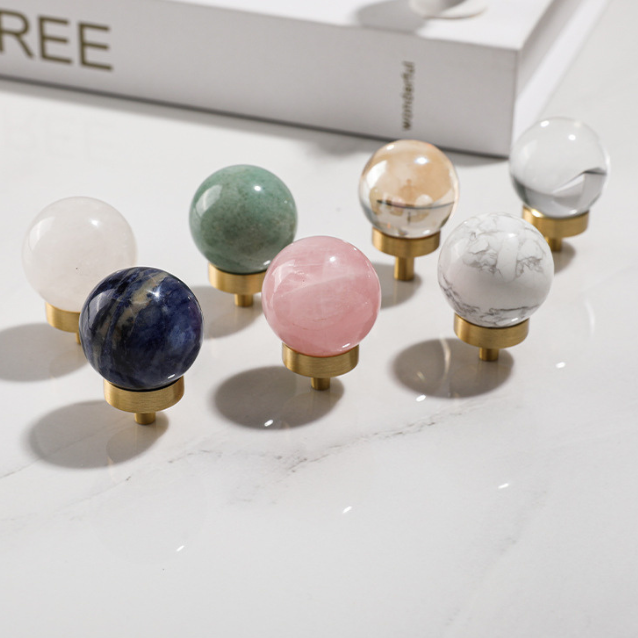 Brass essence natural crystal ball and brass cabinet knob, showcasing the clear crystal sphere and ornate metallic finish.