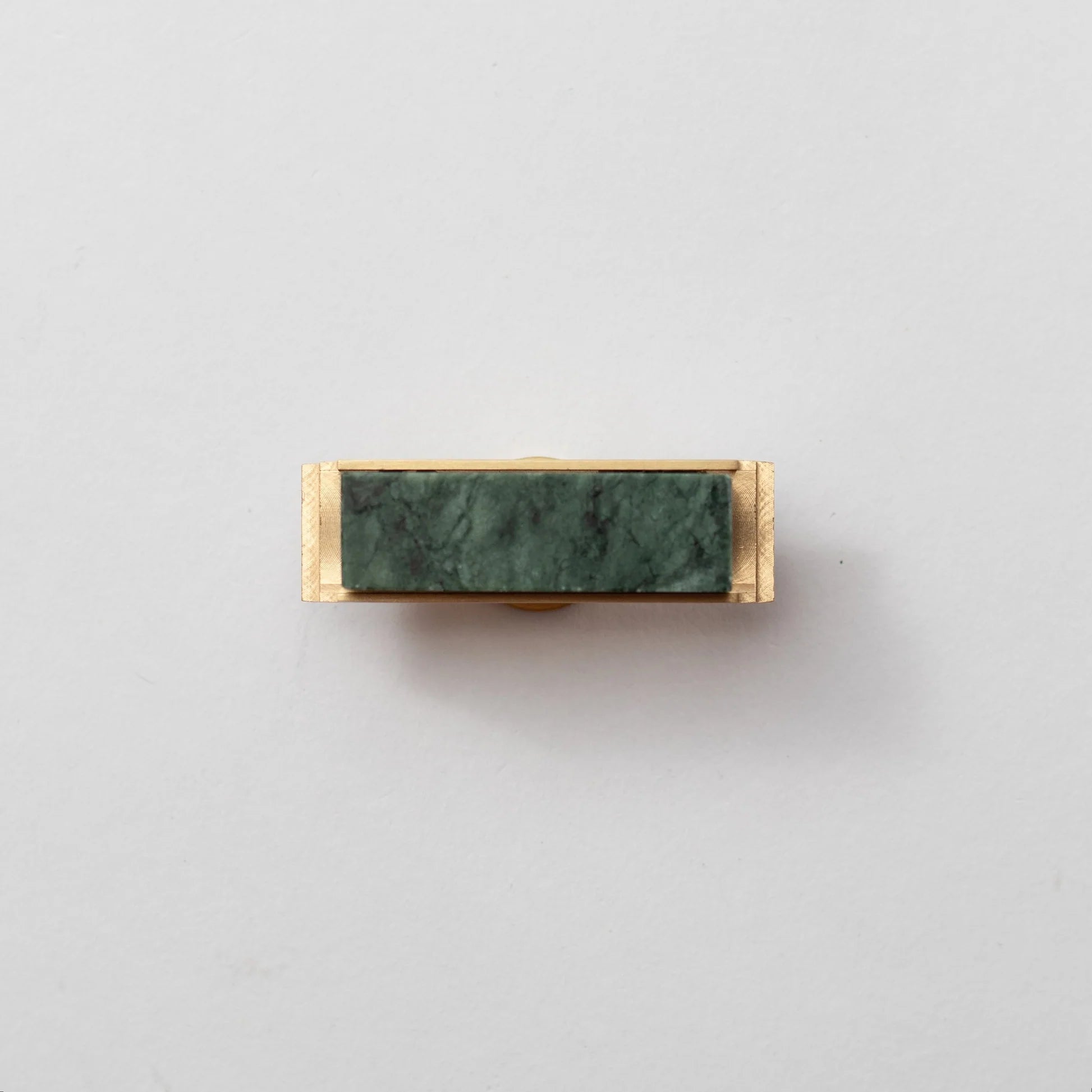Dark green marble and brass T-bar handle by Brass Essence, featuring a modern design with white marble and brass accents.
