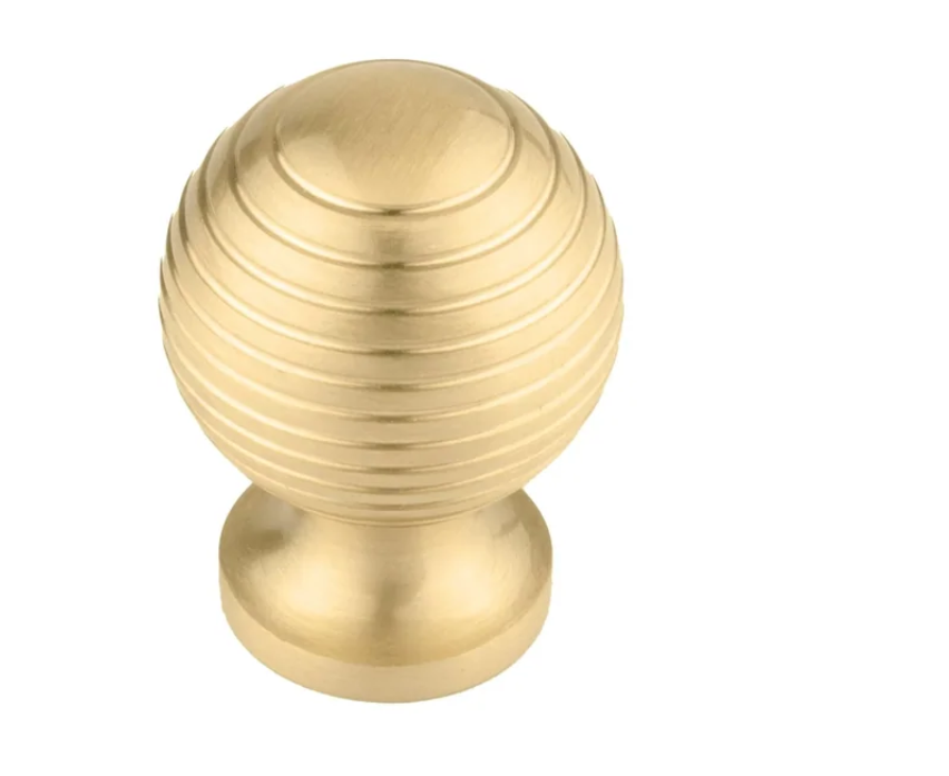 Brass essence Alexander & Wicks brass door knob with luxury brushed finish, showcasing a sleek, polished hardware design.