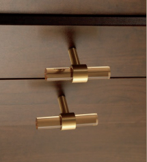 Clear acrylic and brass T-bar handle from Brass Essence collection, showing sleek, modern hardware for furniture or cabinetry.