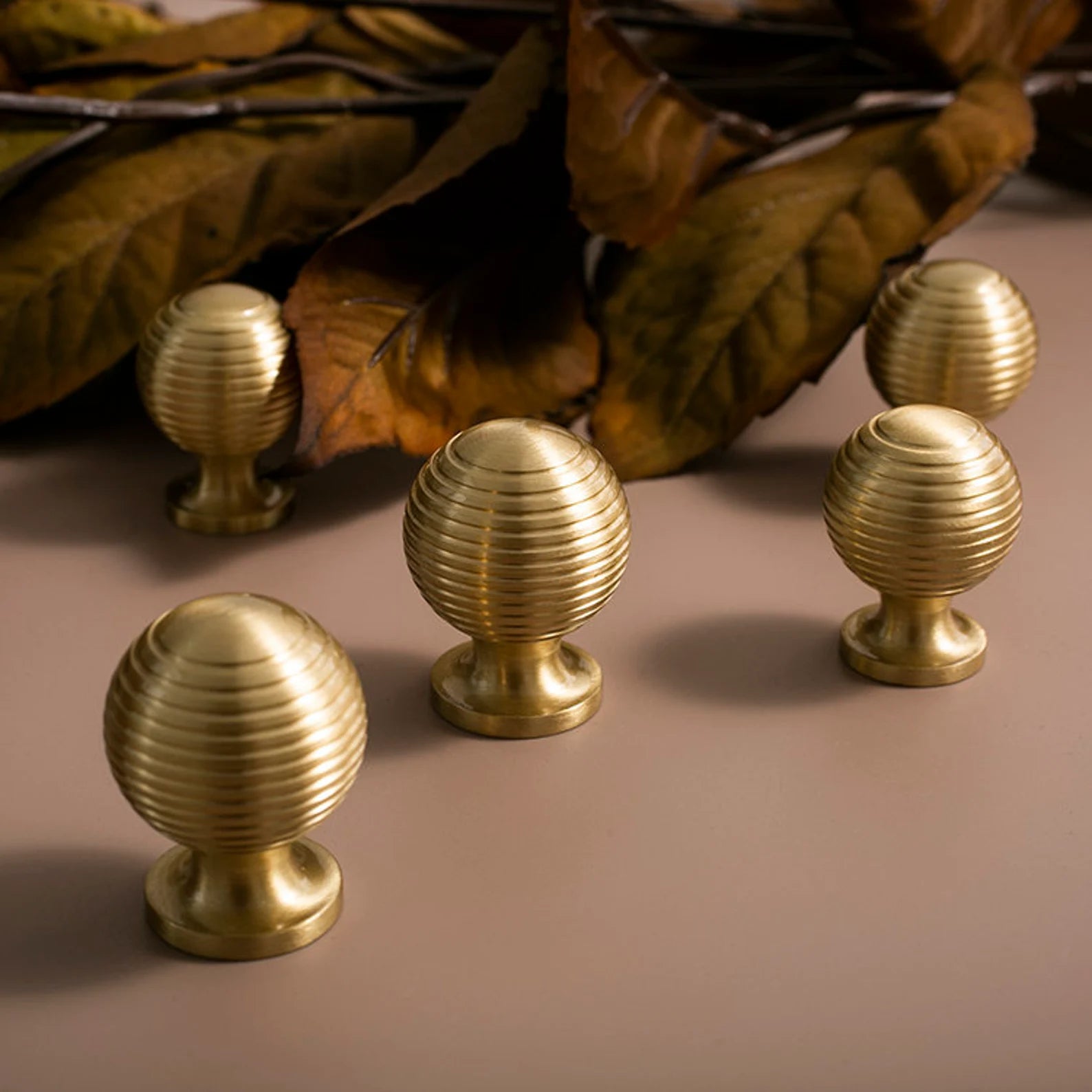 Brass Essence Alexander & Wicks brass knob with luxury brushed finish, featuring a polished round design for cabinet or drawer use.